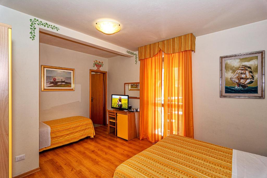 Postel nebo postele na pokoji v ubytování Hotel Mariani