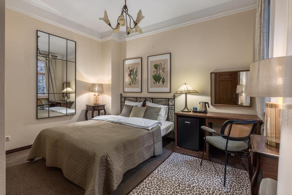 Postel nebo postele na pokoji v ubytování M5 self-service Boutique Hotel