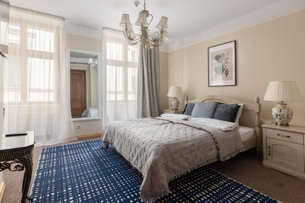 Postel nebo postele na pokoji v ubytování M5 self-service Boutique Hotel