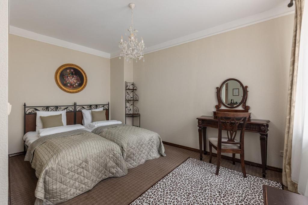 Postel nebo postele na pokoji v ubytování M5 self-service Boutique Hotel