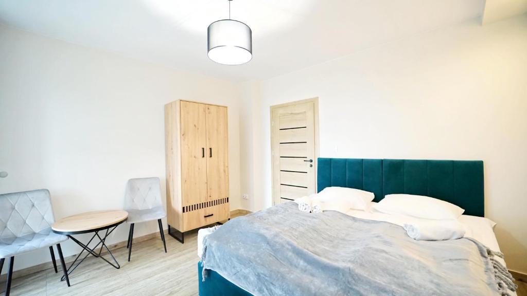 Posteľ alebo postele v izbe v ubytovaní Apartamenty EverySky - Karkonoska 30