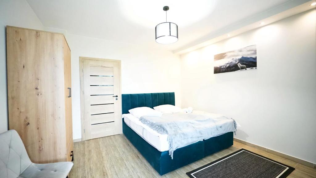 Posteľ alebo postele v izbe v ubytovaní Apartamenty EverySky - Karkonoska 30