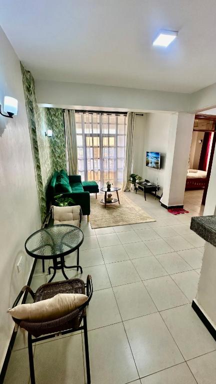 a living room with a couch and a table at Rorot 1 bedroom annex Eldoret,Arlene in Eldoret