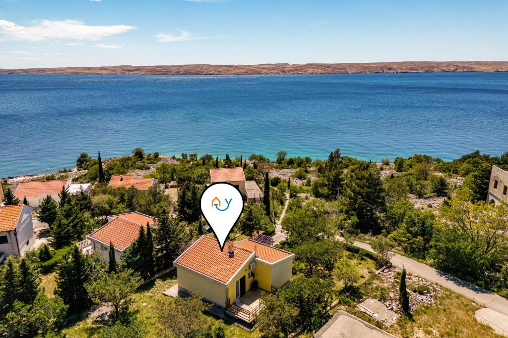 an aerial view of a house with a lake at Beachfront House Nada - Happy Rentals in Karlobag