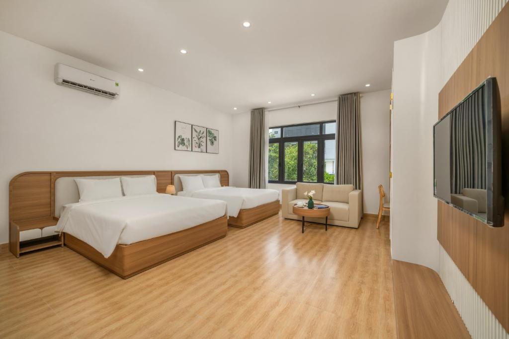 Postel nebo postele na pokoji v ubytování Delak Homestay