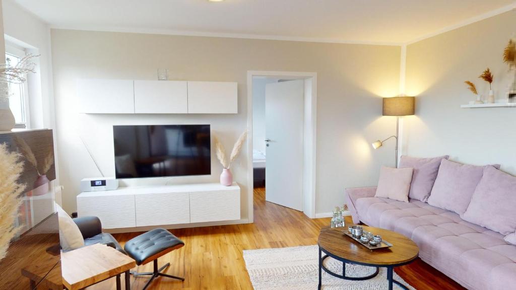 TV a/nebo společenská místnost v ubytování Grüntal-Residenz Haus I App. 5