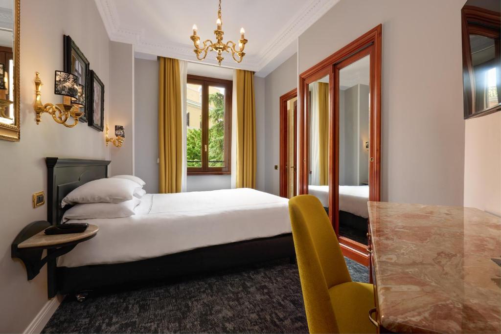Postel nebo postele na pokoji v ubytování Hotel Barberini
