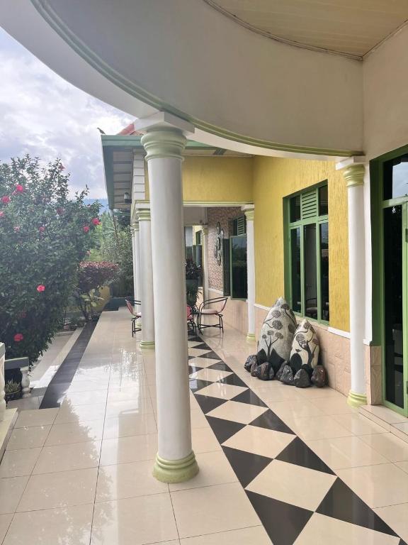 a building with a black and white checkered floor at Home Stay Villa in Kigali