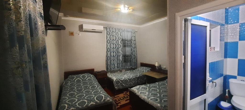 Hotel Zarafshonにあるベッド