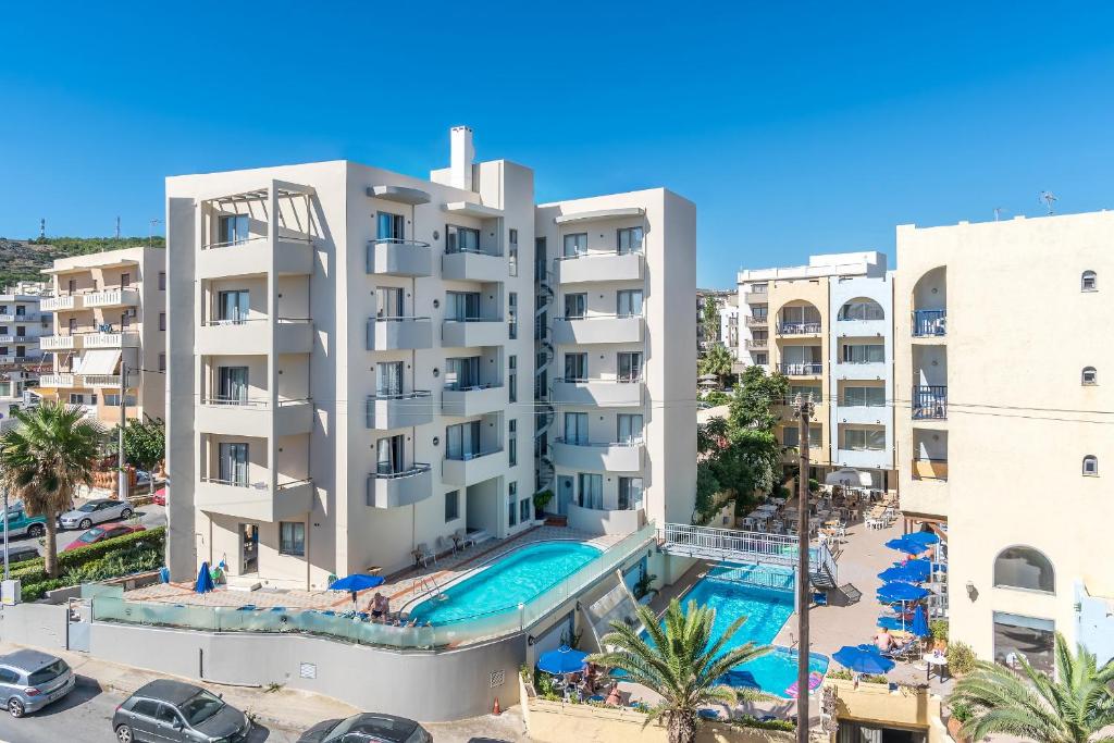 an image of a building with a swimming pool at Lefkoniko Residence Beach & Bay in Rethymno