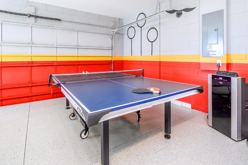 a ping pong table in a ping pong room at Solterra Resort Home - Waterslide and Lazy River in Davenport