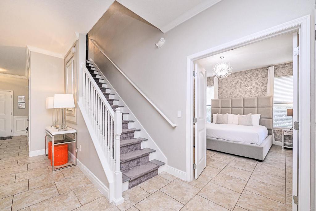 a bedroom with a staircase leading up to a bed at Solterra Resort Home - Waterslide and Lazy River in Davenport