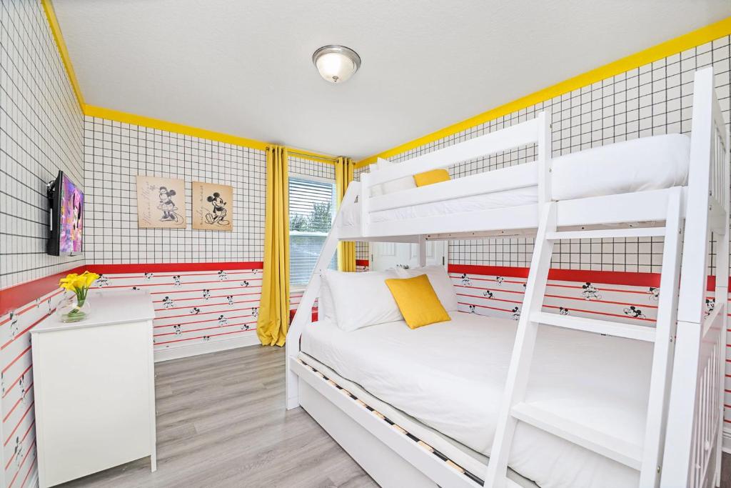 a bedroom with a bunk bed with white bunk beds at Solterra Resort Home - Waterslide and Lazy River in Davenport