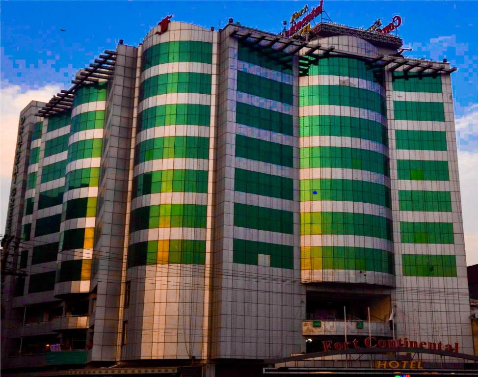 a building with green and yellow stripes on it at Fort Continental Hotel in Peshawar