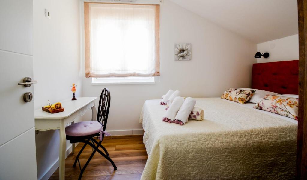 Postel nebo postele na pokoji v ubytování Kuća za odmor LAVANDA