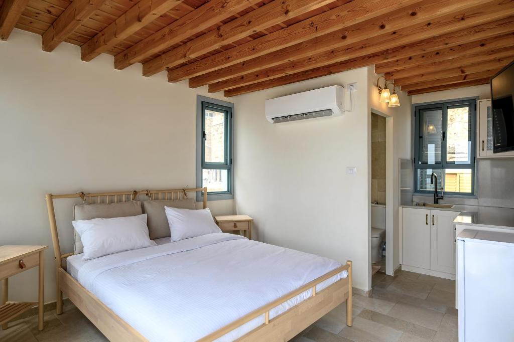 Postel nebo postele na pokoji v ubytování Siwar Boutique Suites