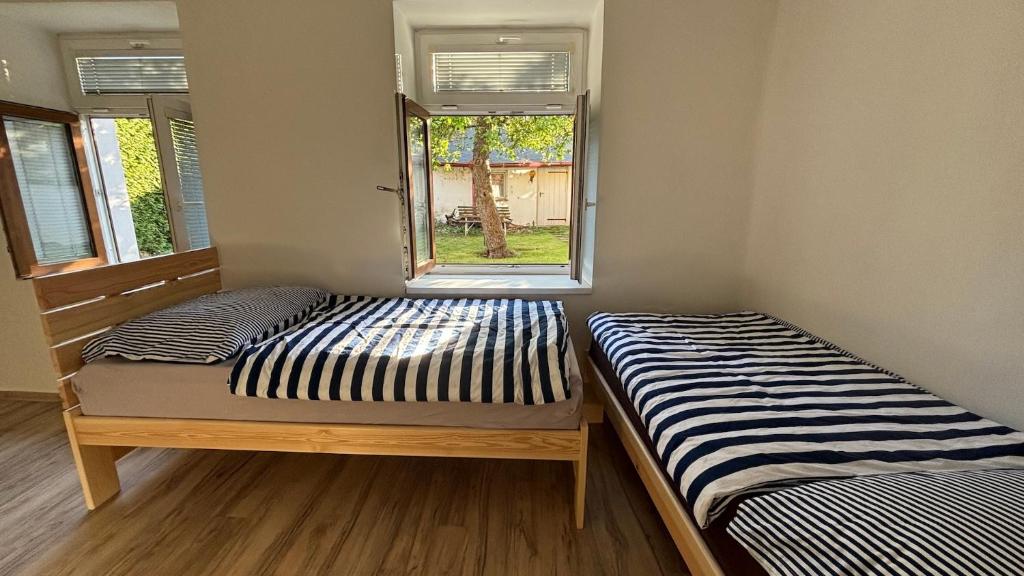 Postel nebo postele na pokoji v ubytování Domek v Třeboni