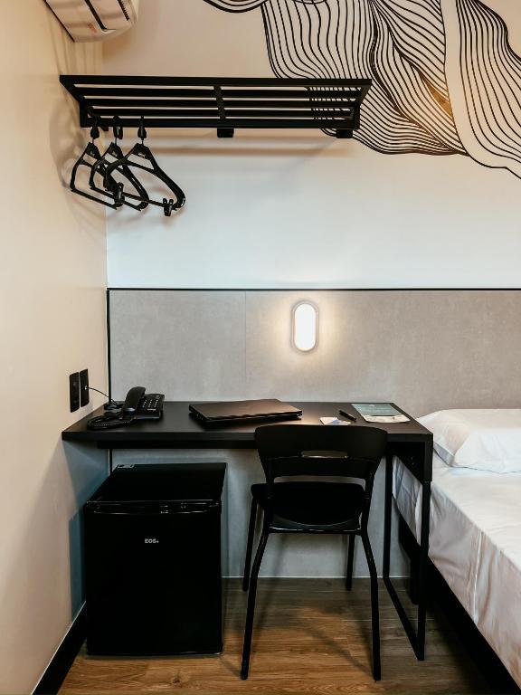 Postel nebo postele na pokoji v ubytování WA HOTEL FORTALEZA