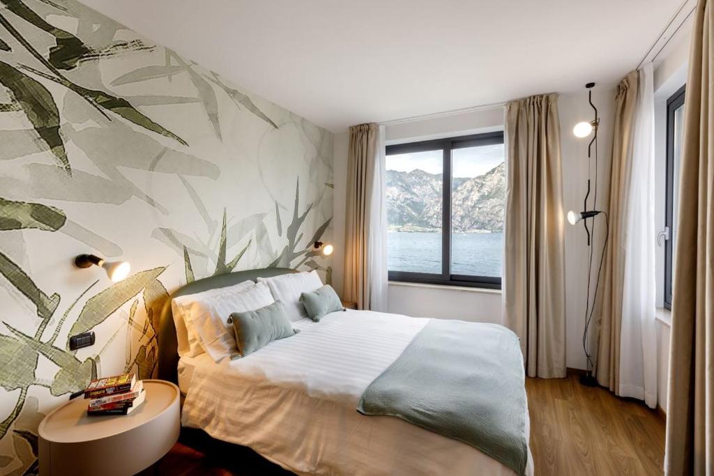 Postel nebo postele na pokoji v ubytování Piccolo Hotel