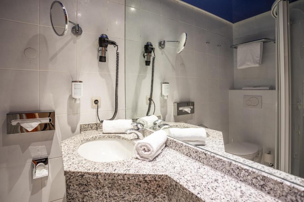 Koupelna v ubytování Koener Hotel & Spa