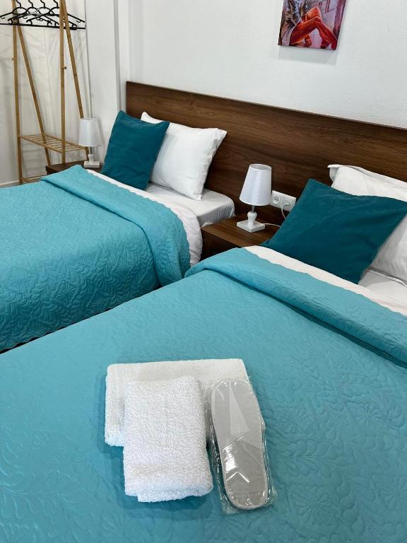 Postel nebo postele na pokoji v ubytování Kutaisi Apartment