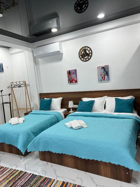 Postel nebo postele na pokoji v ubytování Kutaisi Apartment