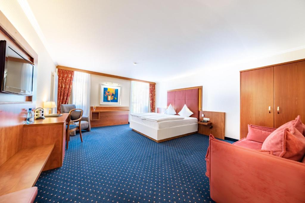 Postel nebo postele na pokoji v ubytování Koener Hotel & Spa