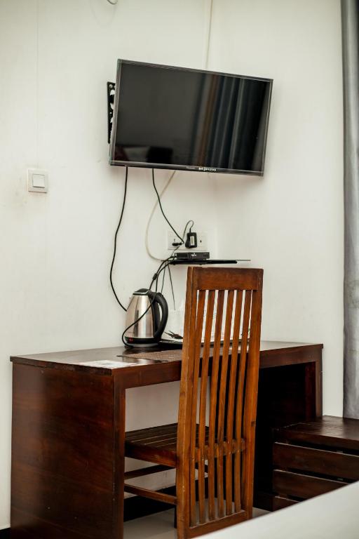TV a/nebo společenská místnost v ubytování Capital Resort Inn