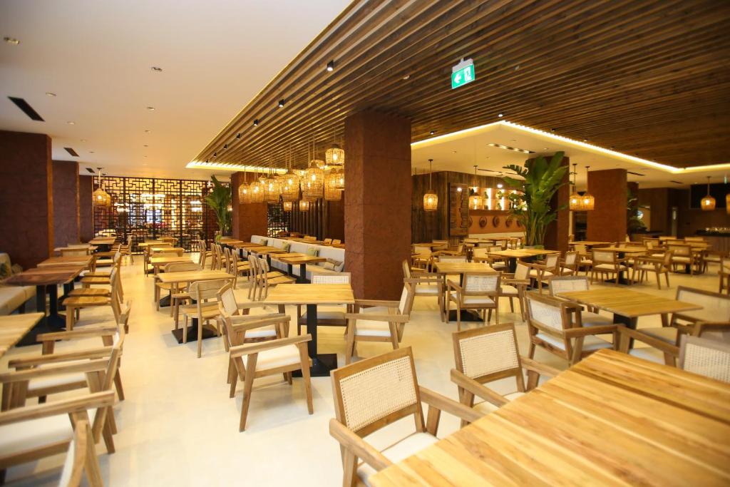 Restoran või mõni muu söögikoht majutusasutuses Regina Palm Resort