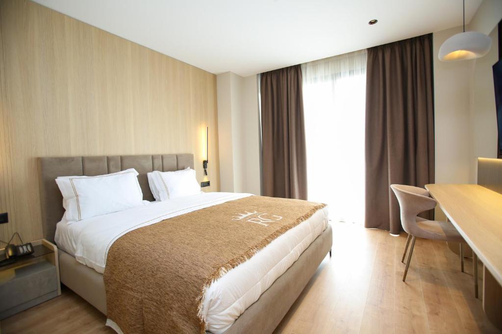 Voodi või voodid majutusasutuse Regina Palm Resort toas