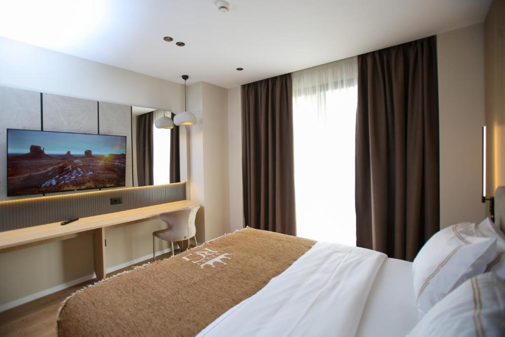 Voodi või voodid majutusasutuse Regina Palm Resort toas
