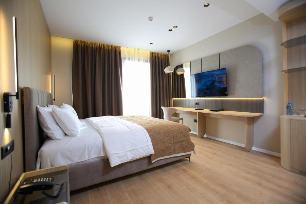 Voodi või voodid majutusasutuse Regina Palm Resort toas