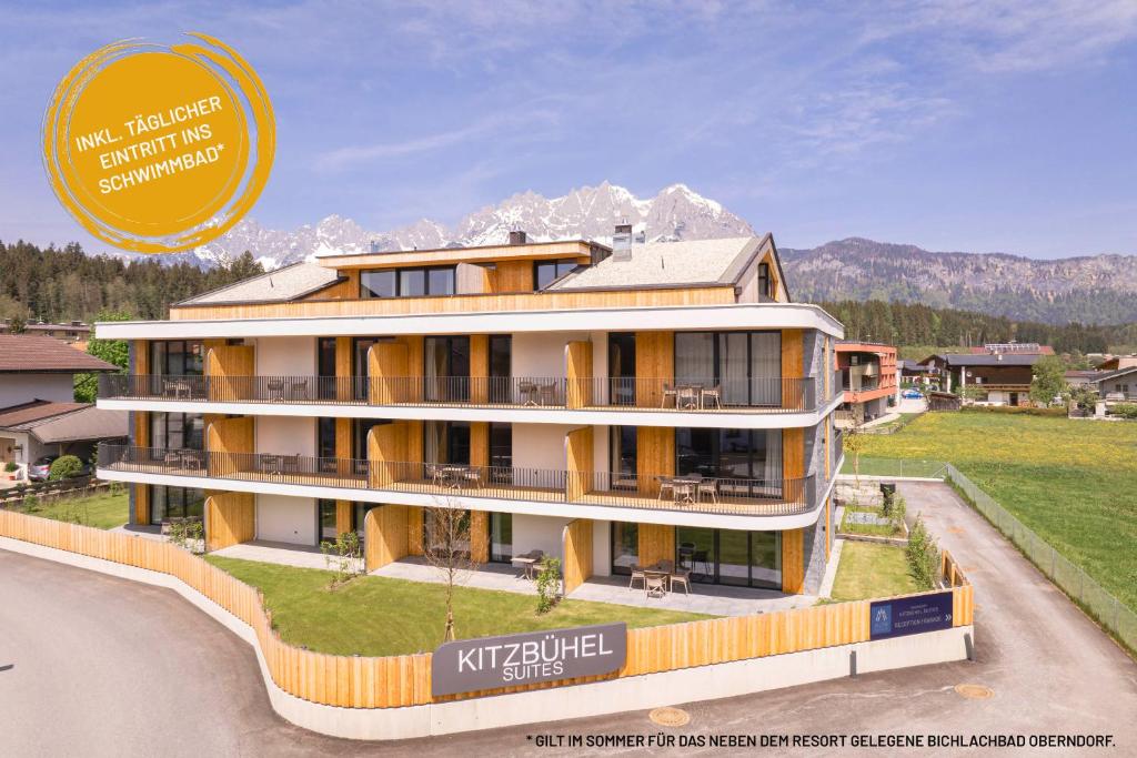 Kitzbühel Suites by ALPS RESORTS في أوبيرندورف إن تيرول: مبنى عليه لافته تقول kirschfeld elite