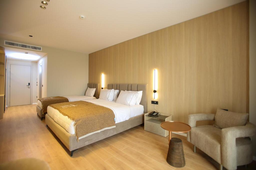Voodi või voodid majutusasutuse Regina Palm Resort toas