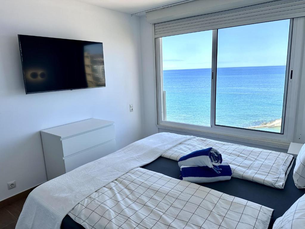 Postel nebo postele na pokoji v ubytování 2 SCHLAFZIMMER FERIENWOHNUNG DiREKT AM STRAND