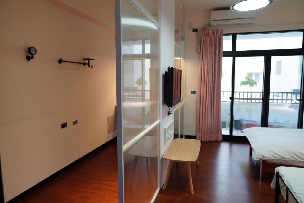 Postel nebo postele na pokoji v ubytování Chenting Yiyu B&B
