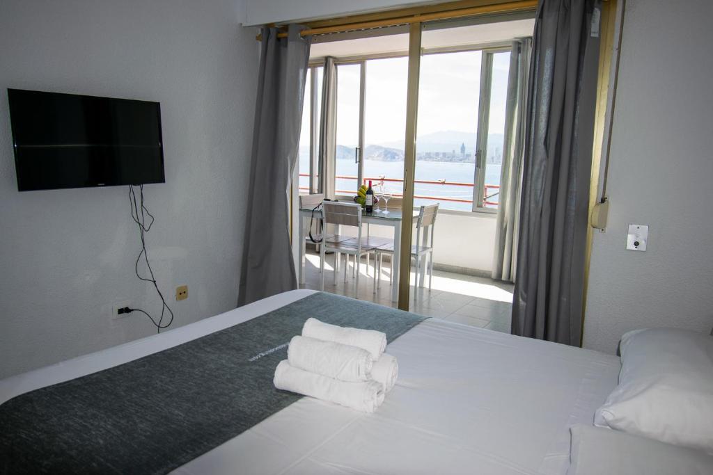 A bed or beds in a room at Don Miguel II 18-G Levante Beach