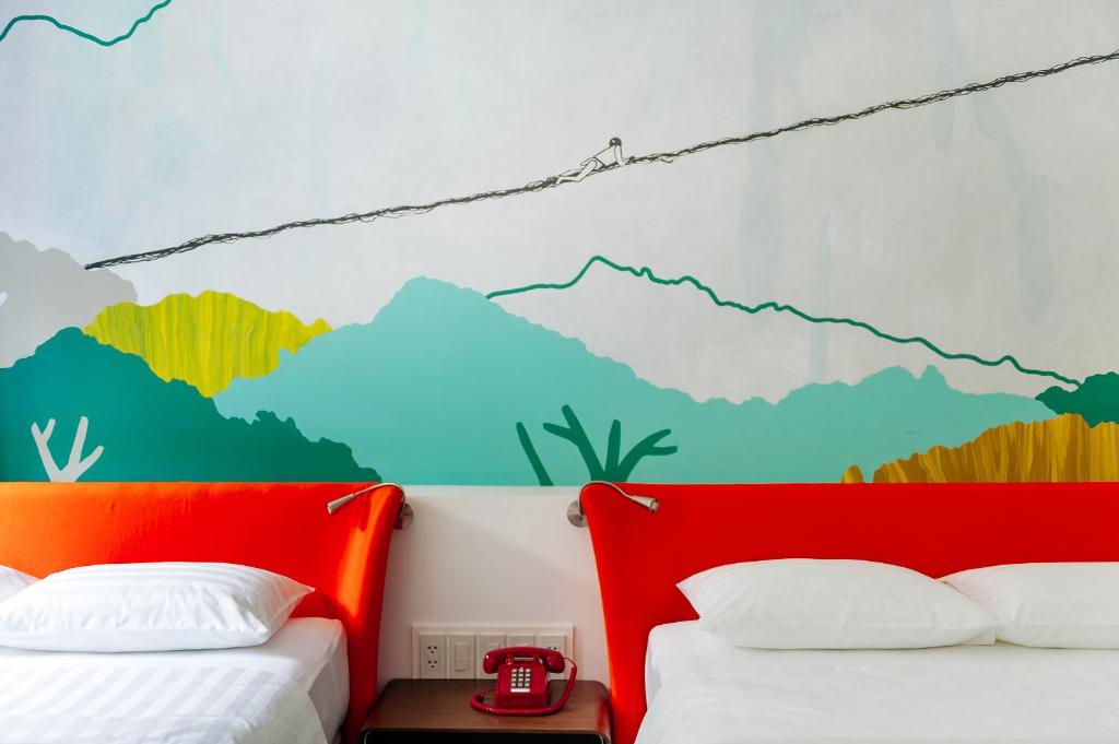 Postel nebo postele na pokoji v ubytování Canvas Boutique Hotel