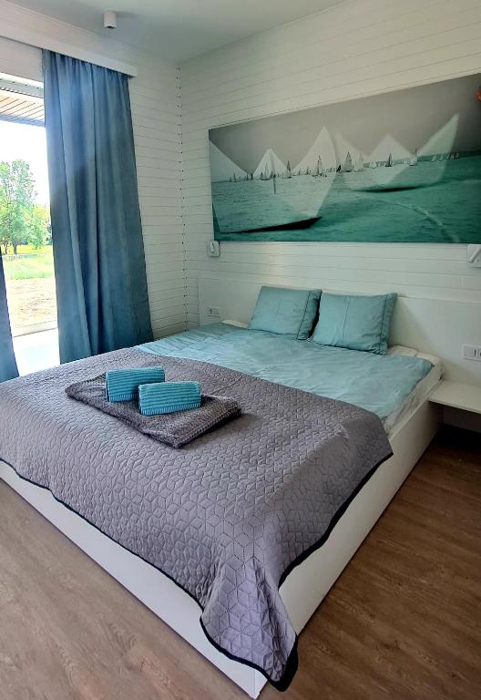 Postel nebo postele na pokoji v ubytování Beach Arena Csopak