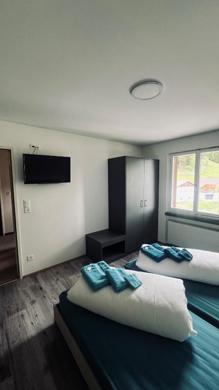 Postel nebo postele na pokoji v ubytování Hotel Péz Ault