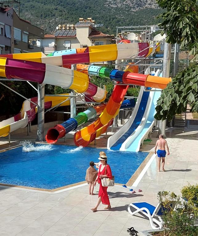 a large water park with a water slide at Kleopatra Royal Palm Hotel in Alanya