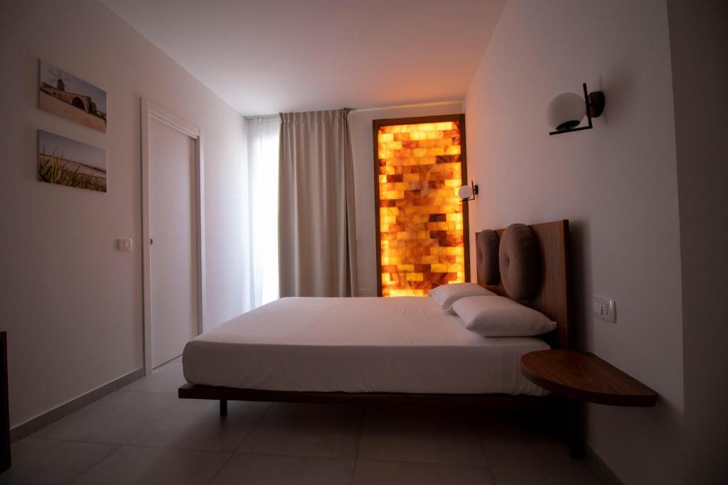 Postel nebo postele na pokoji v ubytování Hotel Arte Mare