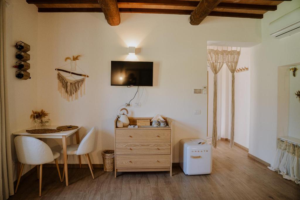 TV a/nebo společenská místnost v ubytování Glamping Le Dune