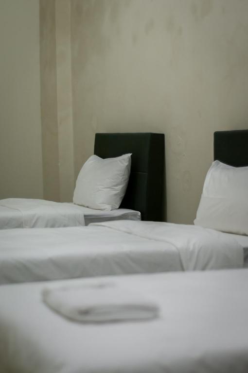 Postel nebo postele na pokoji v ubytování Aayu Beach St George Town Penang