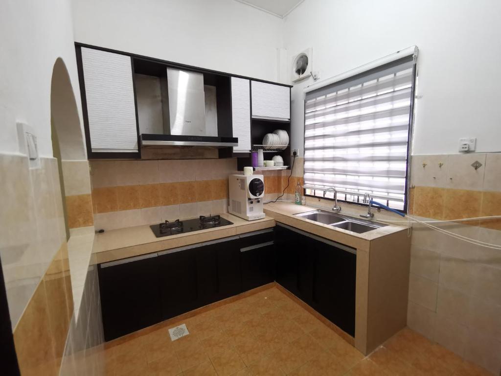 Kuchyň nebo kuchyňský kout v ubytování Kejora Guest House