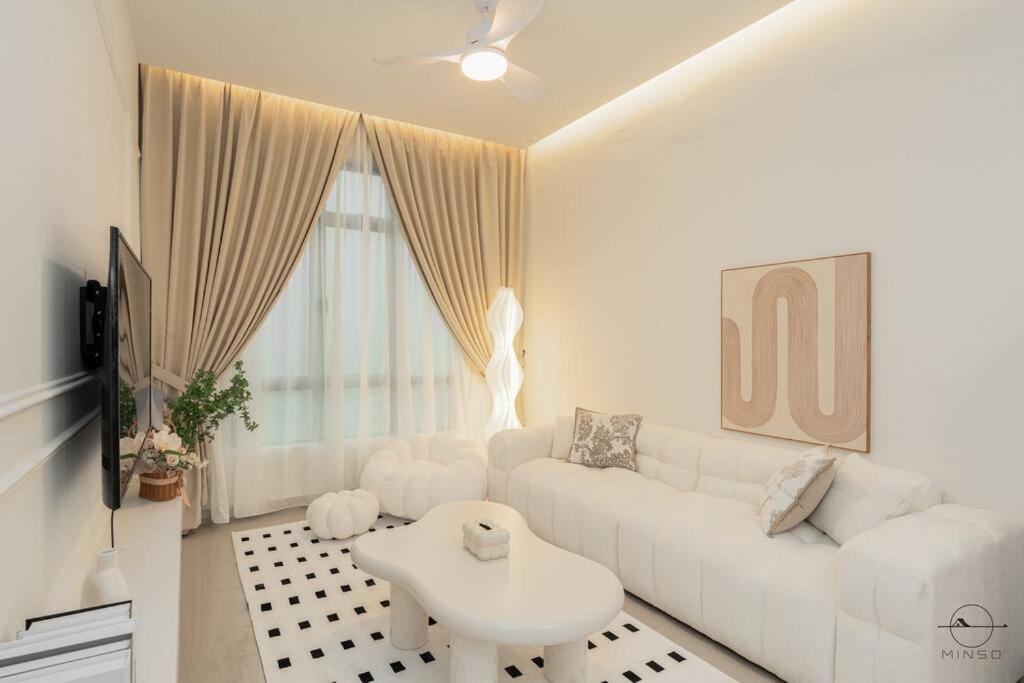 a white living room with a white couch and a table at [Creamy house KSL 2 JB] #6Pax #Austin #18th floor in Johor Bahru