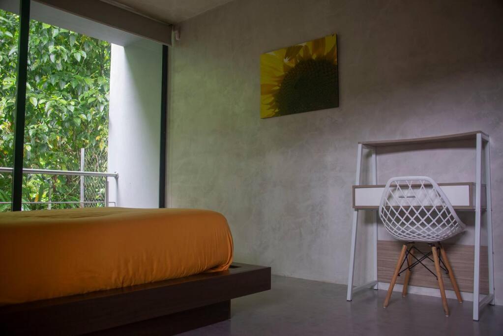 Postel nebo postele na pokoji v ubytování Maison Mindo