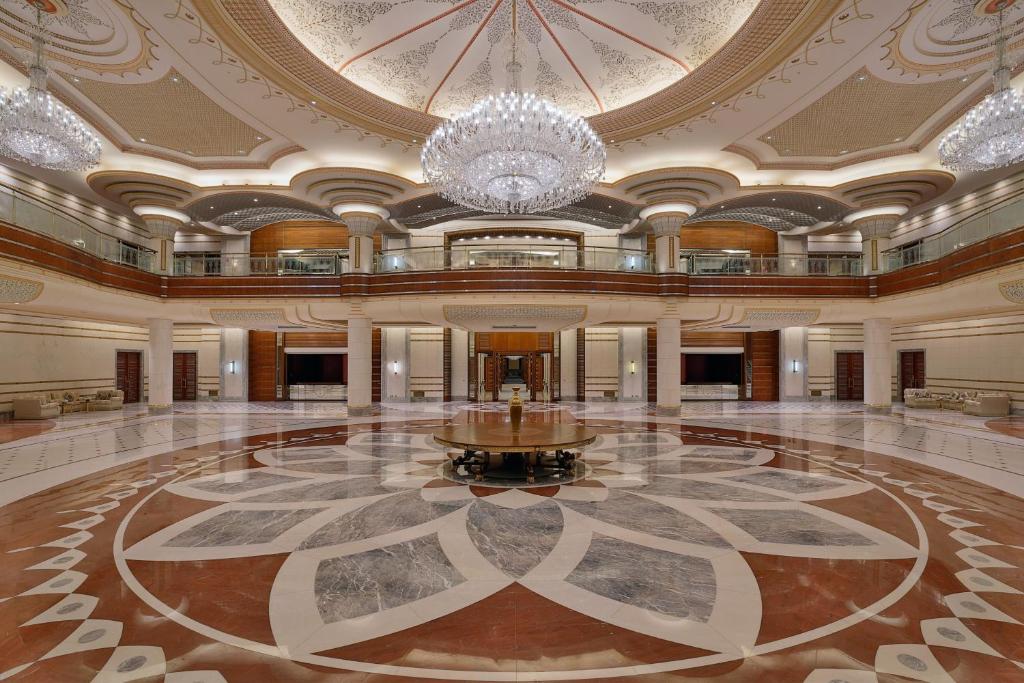 a large lobby with a chandelier and a large floor at The Ritz-Carlton Jeddah in Jeddah