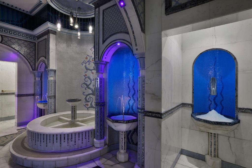 a bathroom with a bath tub and a sink at The Ritz-Carlton Jeddah in Jeddah