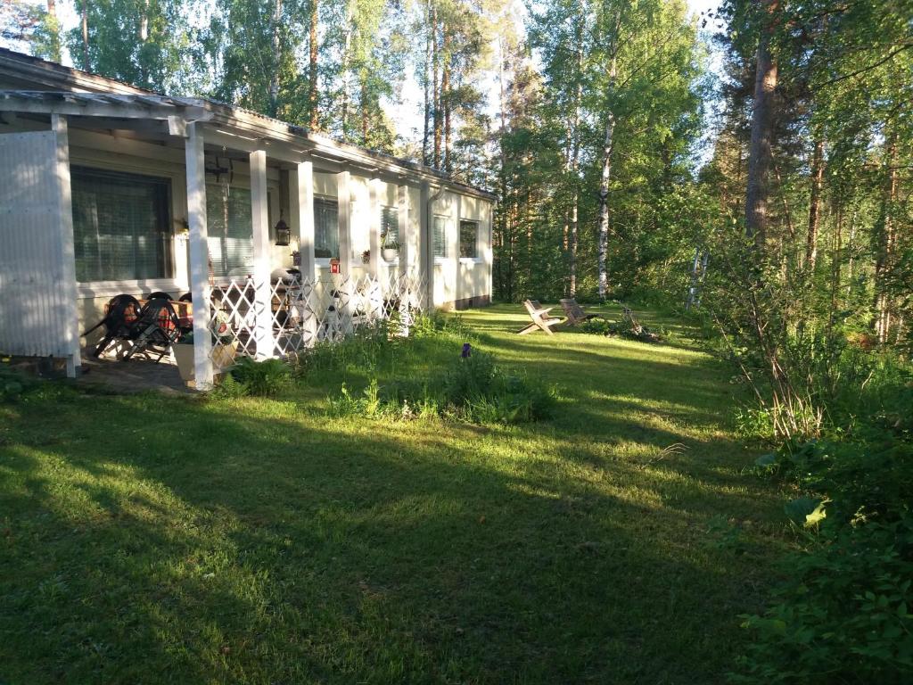 a house in the middle of a grassy yard at Apartment Sorsakoski in Sorsakoski